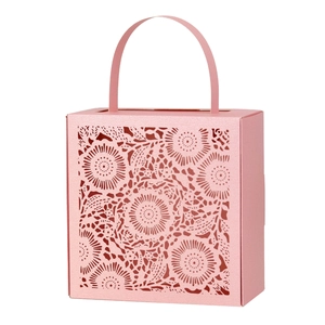 Pink laser-cut lace candy box with floral patterns and curved handle for wedding gifts