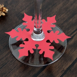 Red snowflake paper place cards for wine glass decoration and Christmas table settings
