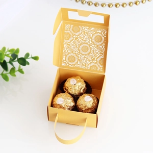 Detailed laser-cut sun flower pattern on a premium golden wedding favor gift box