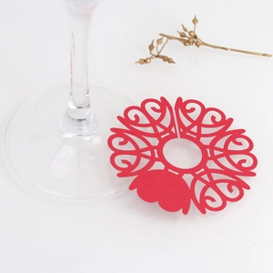 Close-up of laser-cut red heart wine glass name cards for wedding table decorations