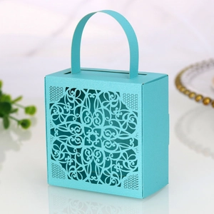 Detailed laser-cut hollow floral pattern on sky blue wedding candy gift box with handle