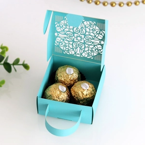 Detailed laser-cut Tiffany blue hollow lace candy box with handle and floral mandala patterns