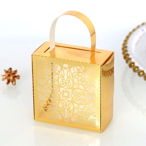 Detailed view of golden lace hollow candy box featuring elegant handle and metallic texture