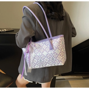 Detail view of purple embroidered tote bag with lace trim and elegant ribbon bow