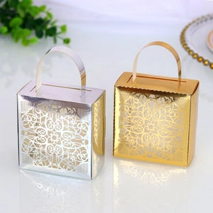 Detailed laser-cut mandala floral patterns on gold and silver mini gift boxes