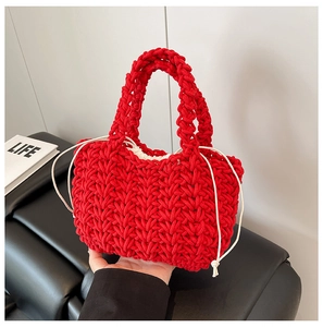 Detailed red woven handbag featuring bold chunky rope knit and a white drawstring lining