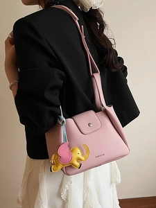 Pink lychee grain leather bucket bag with silver buckle and cute elephant charm