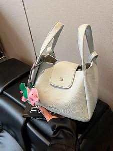 Chic light blue lychee pattern leather bucket bag with cute pink elephant charm