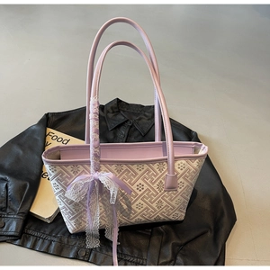 Detail of lavender tote bag with vintage geometric patterns and lace silk bow decor