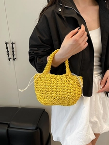 Handmade vibrant yellow woven bucket bag with secure drawstring closure for women