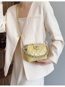 Bright yellow quilted crossbody bag with silver chain and metal turn-lock closure