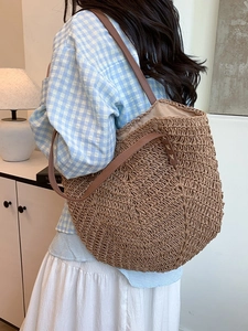 Large capacity straw woven tote bag with dark brown leather straps for summer beach vacation