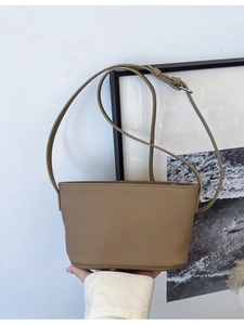 Minimalist khaki bucket bag with lychee texture and adjustable shoulder strap for women