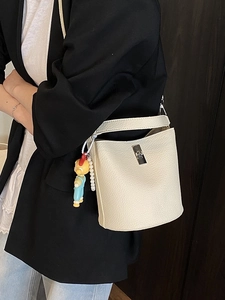 Minimalist creamy white bucket shoulder bag with pearl chain and cute cartoon charm