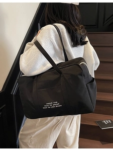 Large capacity black nylon tote travel bag with motivational text for daily commute