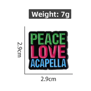Square enamel badge with Peace Love Acapella lettering and 2.9cm dimensions