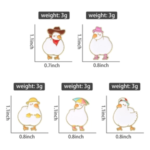 Detail view of cartoon duck enamel pins with dimensions and weight specifications