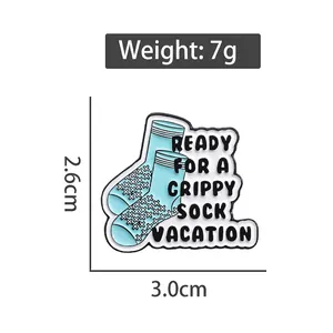 Funny blue sock enamel pin with Grippy Sock Vacation text, size 2.6cm by 3.0cm