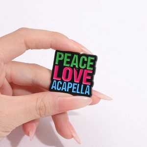 Colorful enamel square brooch with Peace Love Acapella text on black metal base