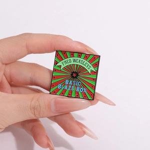Fred Weasley Basic Blaze Box square enamel pin badge with vibrant red and green sunburst
