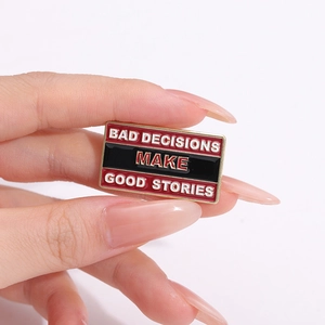 Bad Decisions Make Good Stories enamel pin badge with red and black design