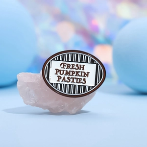 Irregular geometric enamel brooch with Fresh Pumpkin Pasties text on pink crystal base