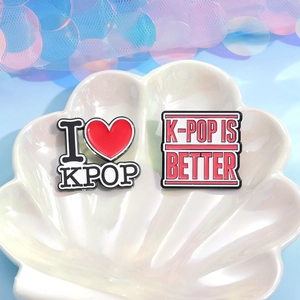 Minimalist I Love KPOP enamel pin set on a shell tray with a colorful aesthetic background