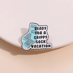 Funny blue grippy sock vacation enamel pin badge with cute cartoon holiday design