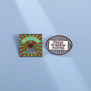 Irregular geometric enamel brooches featuring Fred Weasleys and Pumpkin Pasties designs
