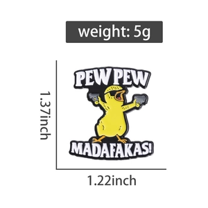 Detail view of cartoon duck enamel pin with dual guns and 1.37x1.22 inch measurements