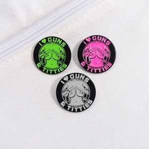 Three-piece set of round enamel badges with bold graphic designs on white canvas