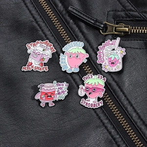 Detailed view of 5pcs cute strawberry enamel pins styled on a black leather jacket