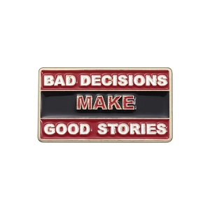 Enamel lapel pin with Bad Decisions Make Good Stories slogan in red and black