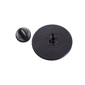 Detailed back view of round alloy brooch with sharp pin and black rubber clutch backing
