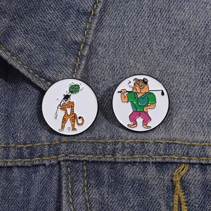 Cartoon tiger and bulldog golf enamel pins on blue denim jacket lapel accessories