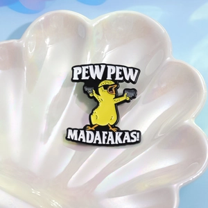 Cool cartoon yellow duck enamel pin with sunglasses and pistols on shell plate