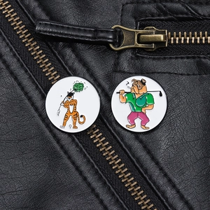 Detail of round enamel golf pins featuring tiger and bulldog on black leather jacket