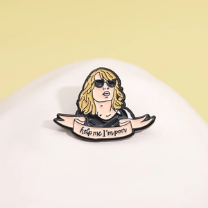 Cool enamel pin featuring a blonde woman in sunglasses and 'help me I'm poor' banner