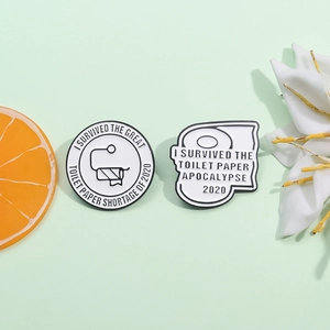 Funny 2020 toilet paper shortage enamel pins with survivor text on mint green background