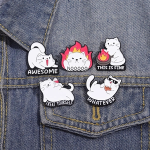 Five-piece cartoon white cat enamel pins set on denim jacket with funny meme captions