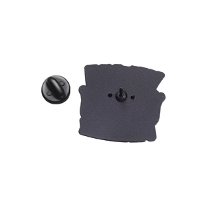 Close-up of the matte black enamel pin back with durable rubber clutch fastening detail