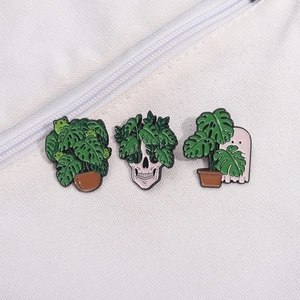 Cartoon plant enamel pins set featuring skeleton and ghost with monstera leaves