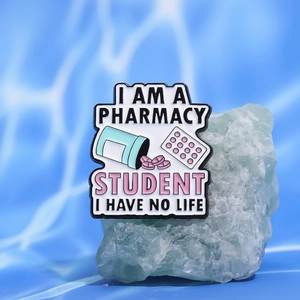 Creative pharmacy student enamel pin featuring colorful pill bottles and medicine theme