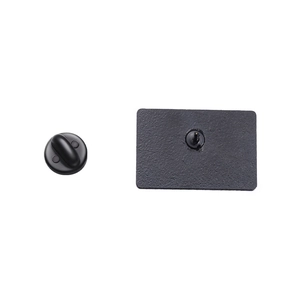 Detailed back view of the black enamel pin showing metal base with butterfly rubber clutch