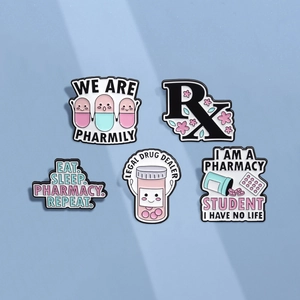 Pink pharmacist enamel pins set featuring capsule characters and RX medical badges