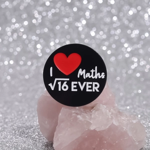 Black round enamel math badge with I heart maths root 16 ever design on pink crystal