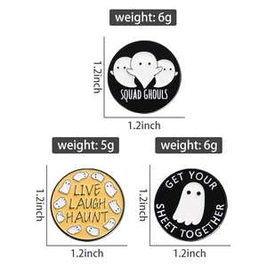 Detailed view of three circular Halloween ghost enamel pins with funny spooky puns
