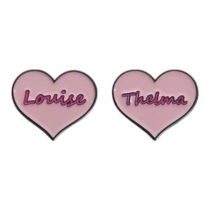 Pink heart enamel brooches with Louise and Thelma engraved text on white background