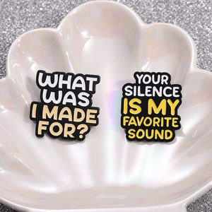 Enamel brooch set featuring Happier Than Ever quotes on a pearlescent shell tray