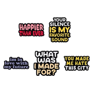 Five-piece set of Happier Than Ever enamel pins with colorful lyric quotes for backpacks